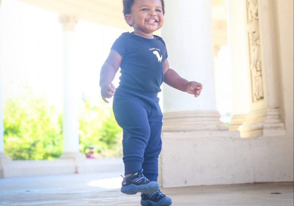 buying toddler shoes, happy boy